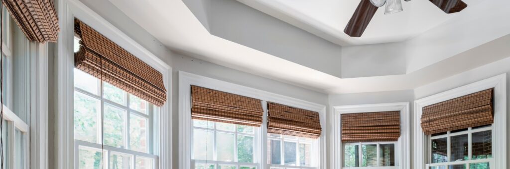Woven wood shades on a row of windows