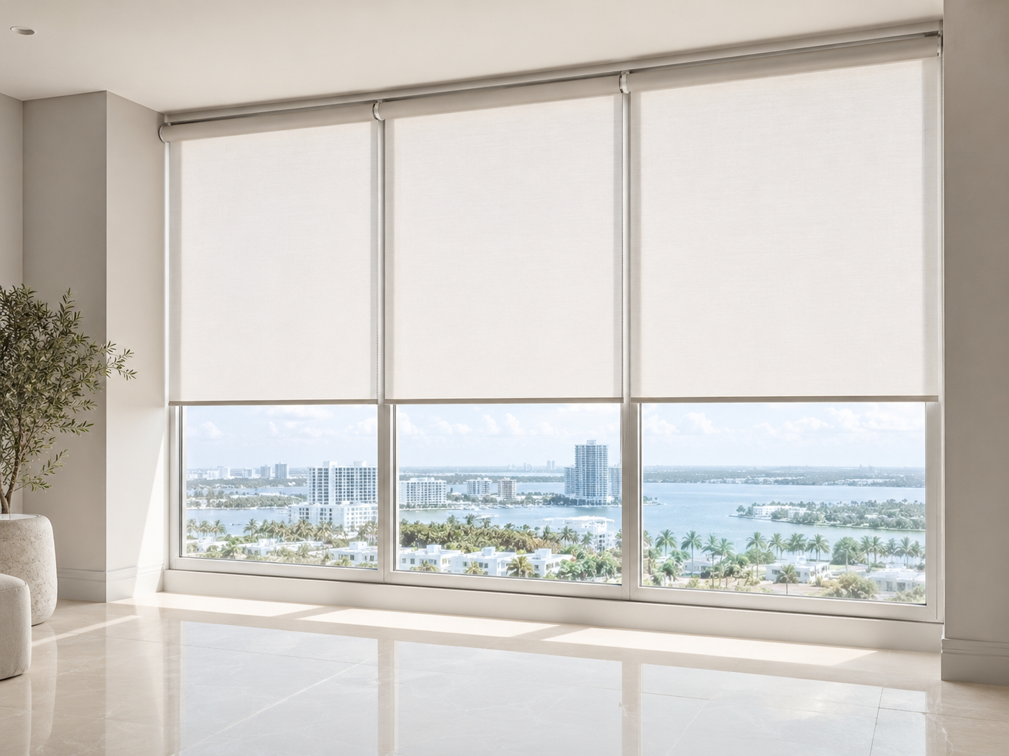 Roller shades installed in Miami condo with panoramic waterfront view of Biscayne Bay